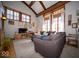 Cozy living room with lots of natural light, a large grey sectional, and hardwood flooring at 198 E Madison St, Franklin, IN 46131