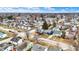 Birds-eye view of neighborhood homes, with a clear blue sky and scattered clouds above at 2002 Fisher Ave, Indianapolis, IN 46224