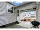 A covered back porch with concrete patio and space for grilling at 2002 Fisher Ave, Indianapolis, IN 46224