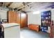 View of the basement, featuring lots of storage space with shelving and cabinets at 2002 Fisher Ave, Indianapolis, IN 46224