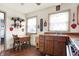 Well-lit eat-in kitchen with stainless steel sink and ample storage at 2002 Fisher Ave, Indianapolis, IN 46224