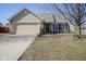 Charming single-Gathering home featuring a well-manicured lawn and a two-car garage at 2167 Meridian Springs Ln, Greenfield, IN 46140