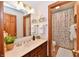 Bathroom with a toilet, shower and sink with wood floors at 226 Sandbrook Cir, Noblesville, IN 46062