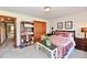 Bedroom with a bed, carpet flooring, and a bookshelf at 226 Sandbrook Cir, Noblesville, IN 46062