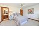 Bedroom with a lamp on the bedside table and hardwood trim at 226 Sandbrook Cir, Noblesville, IN 46062