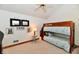 Upstairs bedroom with a bunk bed and carpet at 226 Sandbrook Cir, Noblesville, IN 46062