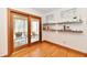 Dining Area with access to screened-in porch and floating shelves with decor at 226 Sandbrook Cir, Noblesville, IN 46062