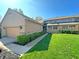 Well-maintained lawn with manicured hedges, walkway leading to the front door, and a two-car garage at 226 Sandbrook Cir, Noblesville, IN 46062