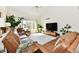 Bright living room boasting large windows, vaulted ceilings, and leather furniture for comfortable seating at 226 Sandbrook Cir, Noblesville, IN 46062