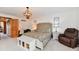 Well-lit main bedroom with carpet flooring, a bed, and a desk with a chair at 226 Sandbrook Cir, Noblesville, IN 46062