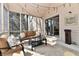 A cozy screened porch with seating, string lights, and a view to an outdoor at 226 Sandbrook Cir, Noblesville, IN 46062