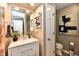 Well-lit bathroom with a modern vanity, stylish mirror, and elegant decorative accents at 2456 N Willow Way, Indianapolis, IN 46268