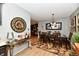 Inviting dining room featuring a stylish chandelier, dark wood table, and colorful accents at 2456 N Willow Way, Indianapolis, IN 46268