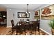 Elegant dining room with a wooden table set, chandelier lighting, neutral wall colors, and decorative accents at 2456 N Willow Way, Indianapolis, IN 46268