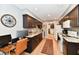 Efficient galley kitchen featuring dark wood cabinets, granite countertops, and modern appliances at 2456 N Willow Way, Indianapolis, IN 46268