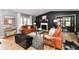 Open-concept living room with a fireplace, stylish furniture, hardwood floors, and large windows for ample natural light at 2456 N Willow Way, Indianapolis, IN 46268
