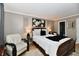 Inviting main bedroom features a king-sized bed, plush bedding, and soft, neutral tones at 2456 N Willow Way, Indianapolis, IN 46268
