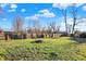 A grassy backyard with a fire pit and a playground at 3011 S 550 W, Columbus, IN 47201