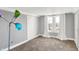 Bright carpeted bedroom with natural light from two windows and grey painted walls at 3011 S 550 W, Columbus, IN 47201