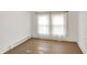 An empty room with hardwood floors and lots of light coming in from the window at 3011 S 550 W, Columbus, IN 47201