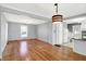 Spacious living room featuring hardwood floors, ample natural light, and neutral paint, an inviting space at 3011 S 550 W, Columbus, IN 47201