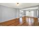 Inviting living room showcasing hardwood floors, neutral paint, and an open flow to the adjoining dining area at 3011 S 550 W, Columbus, IN 47201