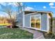An outbuilding with sliding glass doors and a brick walkway surrounded by grass at 3011 S 550 W, Columbus, IN 47201