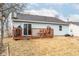 A cozy backyard featuring a small deck with outdoor seating and a grill, perfect for relaxing or entertaining at 3121 River Birch Dr, Indianapolis, IN 46235
