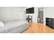 Comfortable bedroom with a bed, tv, hardwood floors and adjacent bathroom at 3121 River Birch Dr, Indianapolis, IN 46235
