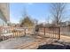 The wooden deck has a small table with chairs and a dark seating chair at 3121 River Birch Dr, Indianapolis, IN 46235
