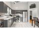 Spacious kitchen featuring stainless steel appliances, gray cabinets, and tile flooring at 3121 River Birch Dr, Indianapolis, IN 46235