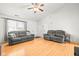 Spacious living room with hardwood floors, vaulted ceilings, and modern furniture at 3121 River Birch Dr, Indianapolis, IN 46235