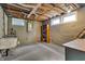 Unfinished basement with exposed ceiling and block walls at 3416 Guilford Ave, Indianapolis, IN 46205