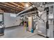 Unfinished basement area with utilities, including water heater and furnace at 3416 Guilford Ave, Indianapolis, IN 46205