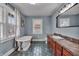 Bathroom features a soaking tub, large windows and vanity at 3416 Guilford Ave, Indianapolis, IN 46205
