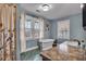 Bathroom features a soaking tub, large windows and modern fixtures at 3416 Guilford Ave, Indianapolis, IN 46205