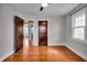 Bedroom with hardwood floors and wooden doors at 3416 Guilford Ave, Indianapolis, IN 46205