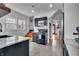 Stylish kitchen with black cabinets, stainless steel appliances, subway tile backsplash, and hexagonal tile flooring at 3416 Guilford Ave, Indianapolis, IN 46205