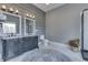 This elegant bathroom boasts a double sink vanity and decorative rug at 4034 W 700 S, Shelbyville, IN 46176