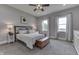Cozy bedroom featuring a ceiling fan, carpeted floor, and lots of natural lighting at 4034 W 700 S, Shelbyville, IN 46176