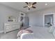 This bedroom features neutral walls and a large dresser with mirror at 4034 W 700 S, Shelbyville, IN 46176