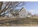 Charming two-story home featuring a inviting front porch and classic architectural details at 4034 W 700 S, Shelbyville, IN 46176