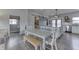 Open kitchen design featuring an island, stainless steel appliances, and seamless flow into dining area at 4034 W 700 S, Shelbyville, IN 46176