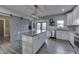 Spacious kitchen featuring a large island, stainless steel appliances, and stylish sliding barn doors at 4034 W 700 S, Shelbyville, IN 46176