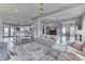 An open concept living room and dining area with neutral colors and stylish furnishings at 4034 W 700 S, Shelbyville, IN 46176