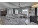 The living room area with couches, decorations, and large windows at 4034 W 700 S, Shelbyville, IN 46176