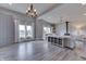 Open-concept living room with large windows, natural light, and a charming wood burning stove at 4034 W 700 S, Shelbyville, IN 46176