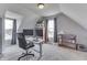 Bright home office features neutral walls and carpet, natural light from two windows and a work space at 4034 W 700 S, Shelbyville, IN 46176