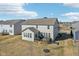 Backyard view of a two-story house with a deck and a spacious lawn offers outdoor living at 4905 Andover Pkwy, Westfield, IN 46062