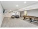 Finished basement with a game table, TV, and lounge area, great for entertainment at 4905 Andover Pkwy, Westfield, IN 46062